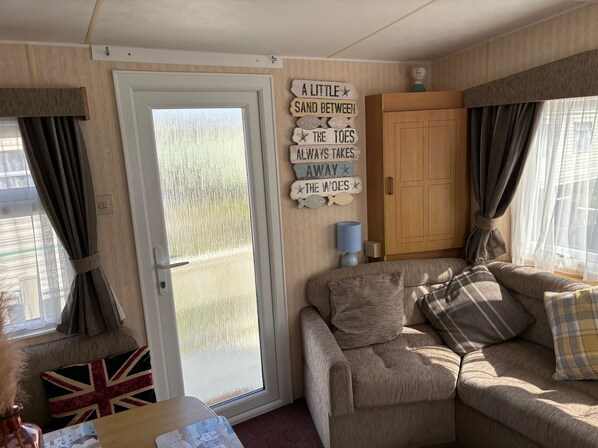 Cabin | Living area | Fireplace - 2-bed Ingoldmells Caravan - Pet Friendly & Decking (Skegness)