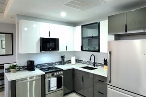 Fridge, microwave, stovetop, dishwasher - Modern High-Rise Apartment - 3 (Tulsa)