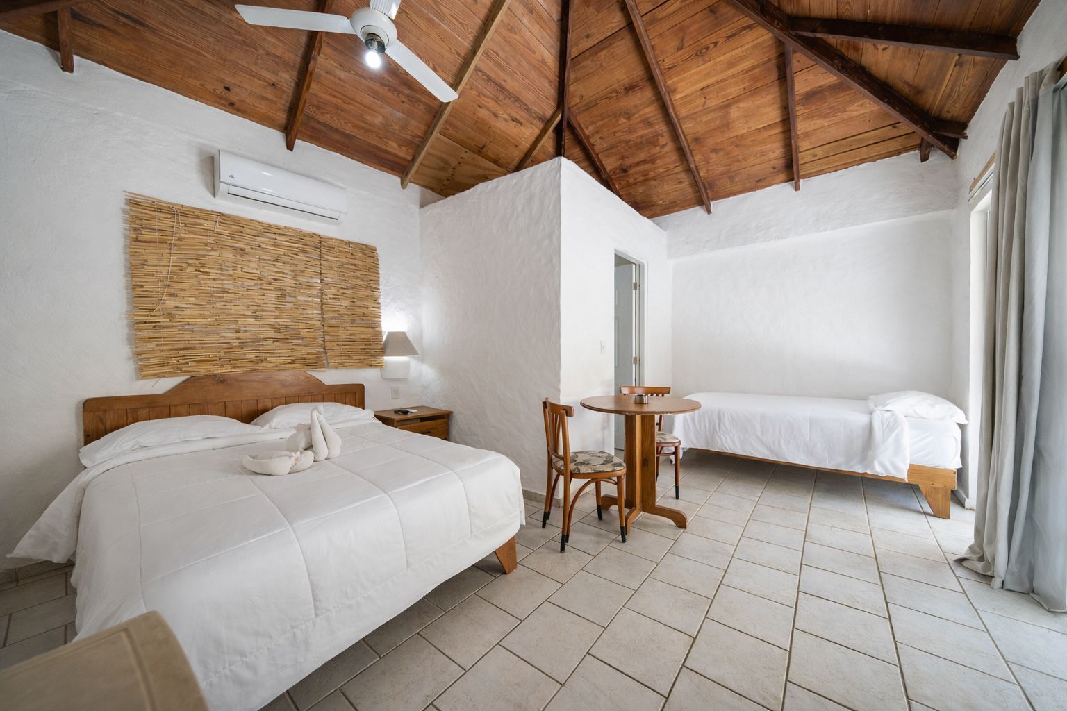 Basic Bungalow, Garden View | In-room safe, laptop workspace, blackout drapes, free WiFi