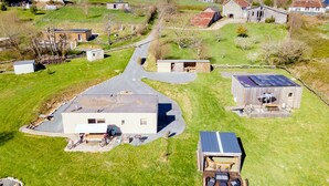 A rural property with a large house, a smaller building, and a fenced yard. - Family Holiday Home in Lubersac – Pond, Garden, Peace & Comfort (Lubersac)