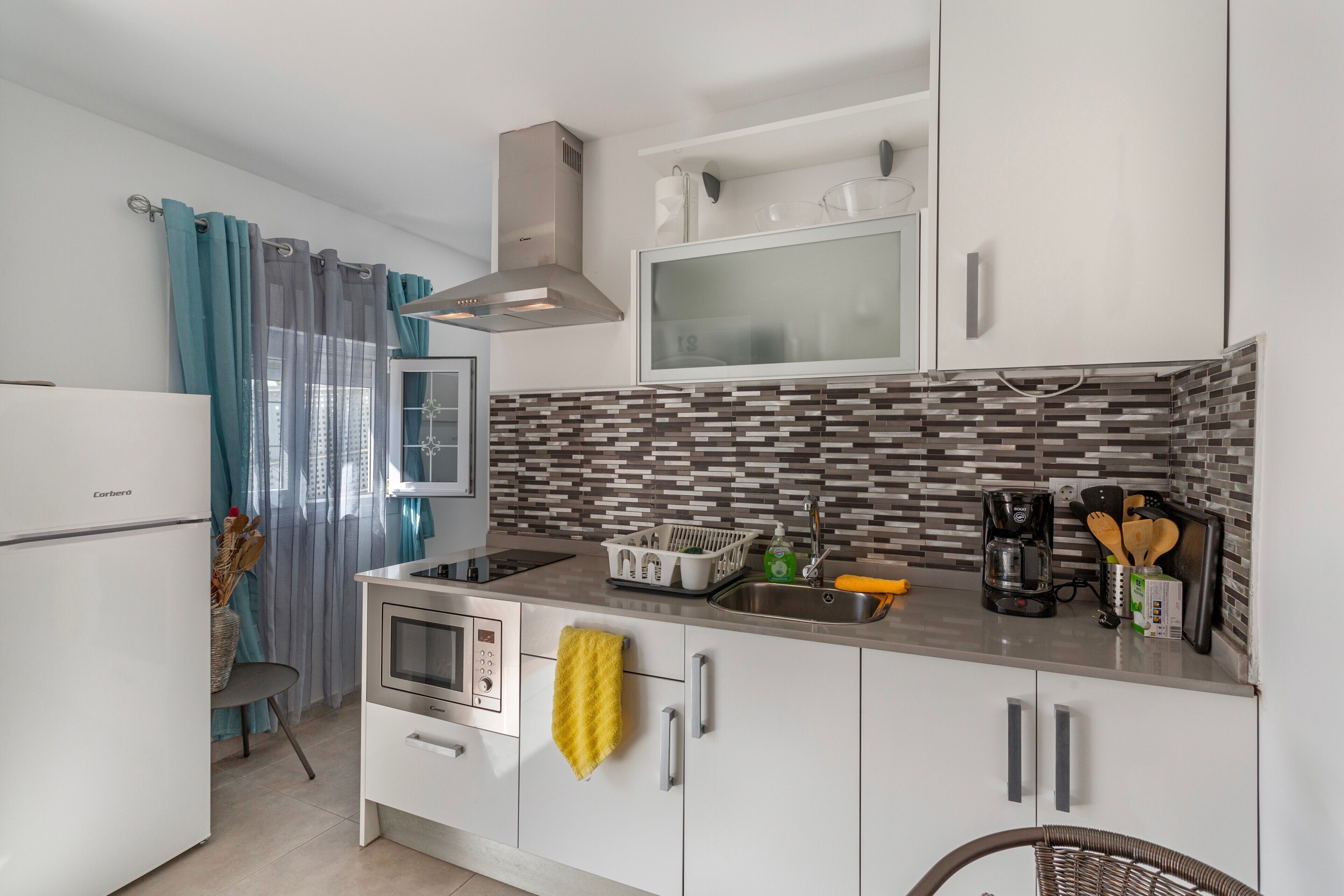 Fridge, microwave, stovetop, coffee/tea maker