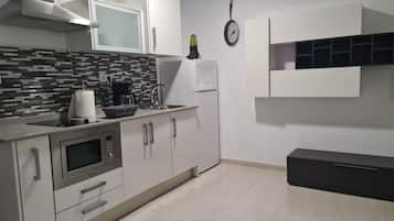 Fridge, microwave, stovetop, coffee/tea maker