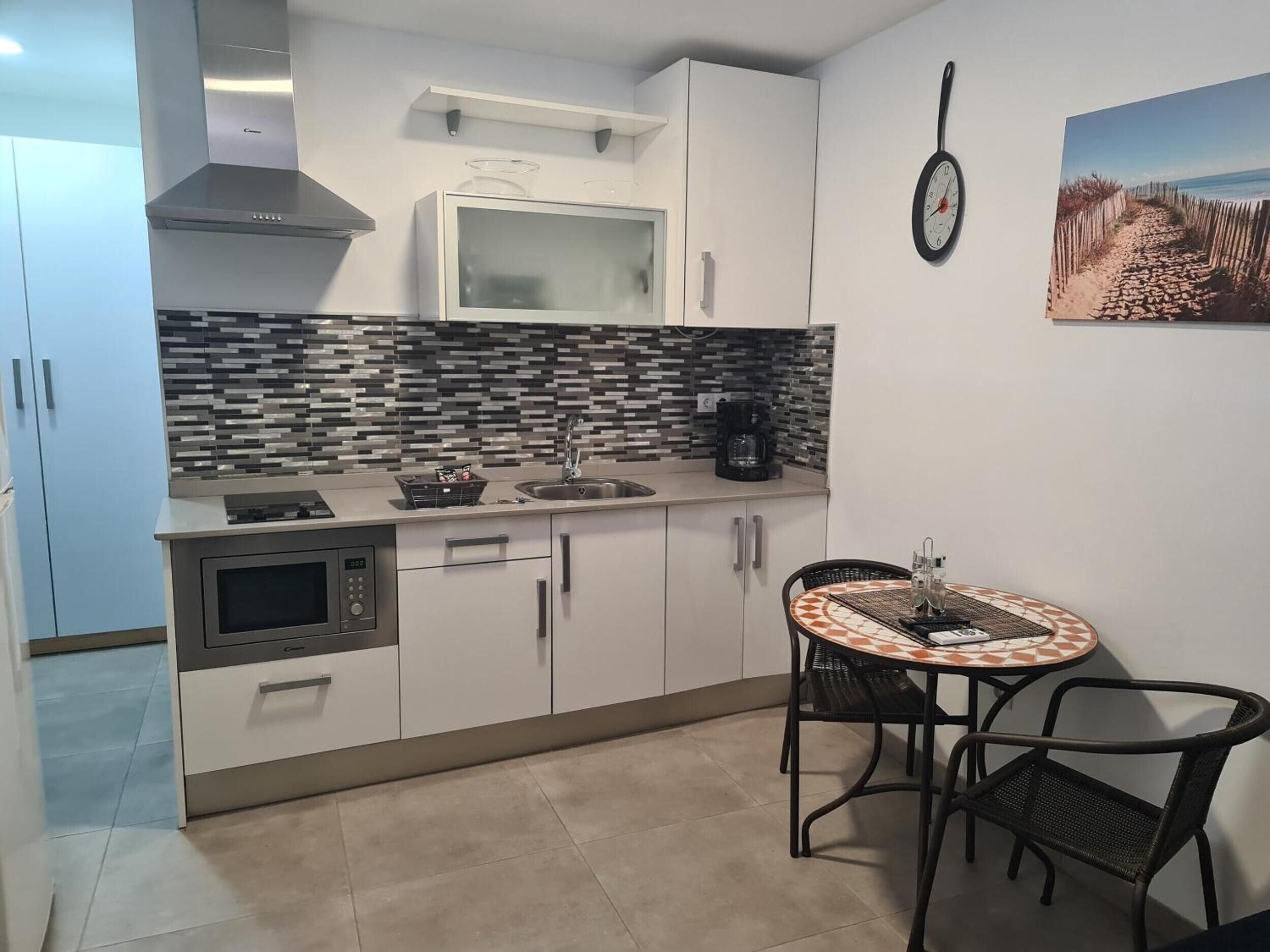 Fridge, microwave, stovetop, coffee/tea maker