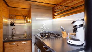 Fridge, stovetop, coffee/tea maker, cookware/dishes/utensils