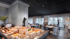 A modern dining area with a variety of food displays, seating arrangements, and a contemporary ceiling design. - Pagoda Hotel Hangzhou Zijingang - Near Zhejiang University and Xixi National Wetland Area (Hangzhou)