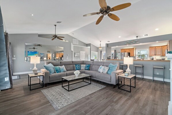 TV, fireplace - Villa Loriann | Waterfront 4-Bedroom Pool Home with Boat Dock | Sleeps 8 (Bonita Springs)