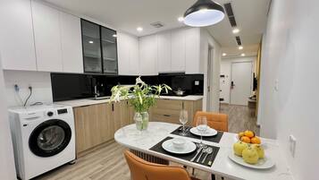 Executive Apartment, City View | Private kitchen | Full-size fridge, ice maker, paper towels, dining tables