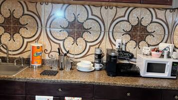 Fridge, microwave, stovetop, coffee/tea maker