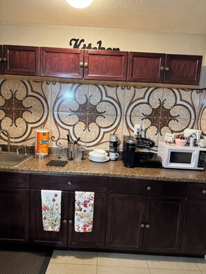 Fridge, microwave, stovetop, coffee/tea maker