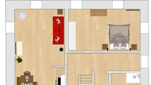 A floor plan of a hotel room with a bed, a small table, a sofa, a chair, a window, and a bathroom.