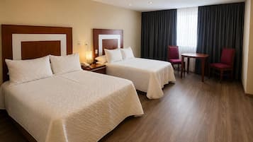 Ropa de cama hipoalergénica y espacio para trabajar con laptop