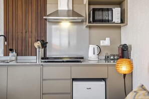 Fridge, microwave, stovetop, coffee/tea maker