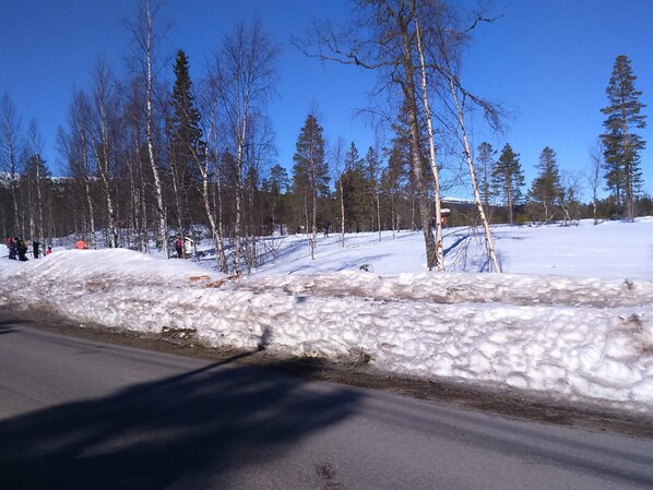 A snowy landscape with a road and trees. - 7 Person Holiday Home in Salen (Transtrand)