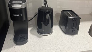 A kitchen with a Keurig coffee maker, a coffee pot, and a toaster on the counter. - 2-Bedrooms | On site Parking | near YQR Airport (Regina)