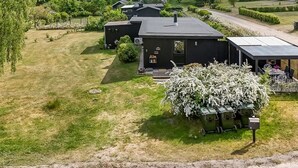 A modern building with a flat roof, surrounded by well-maintained lawns and trees. - "Blomma" - 1km from the sea by Interhome (Ebeltoft)
