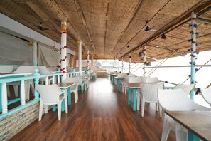 On the beach, white sand, sun loungers, beach umbrellas