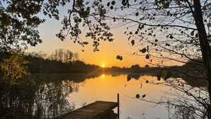 A wooden dock extending into a calm lake at sunset. - Beautiful condominium incl. secured parking space on the outskirts of Hoyerswerda (Hoyerswerda)