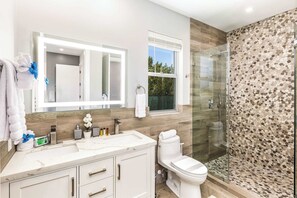 Shower, hair dryer, towels, soap