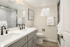 Shower, hair dryer, towels, shampoo