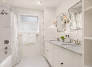 Shower, hair dryer, towels, shampoo