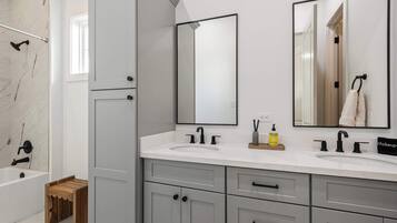 Shower, hair dryer, towels, shampoo