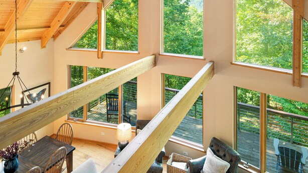 A spacious loft with high ceilings, large windows, and a wooden interior. - Private Mountain Retreat near Breweries and Wineries (Lovingston)