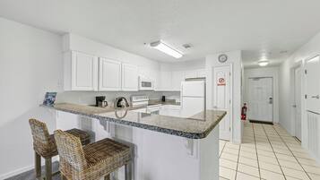 Coffee/tea maker, fridge, microwave, oven