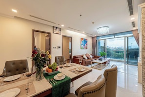 Panoramic Apartment | Private kitchen | Fridge, microwave, stovetop, cookware/dishes/utensils - Cozy- Vinhomes Central Park Apartments (Ho Chi Minh City)