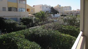 A residential area with multiple apartment buildings, some with balconies and others with terraces. - 40m² apartment ideal for 2 or 4.  50 m from the sea. quiet area. (Agde)