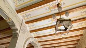 A pool table with balls, a chandelier, and ornate ceiling beams. - Room-disconnection and Comfort in Nature (Alzira)