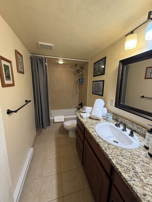 Hair dryer, towels, soap, shampoo