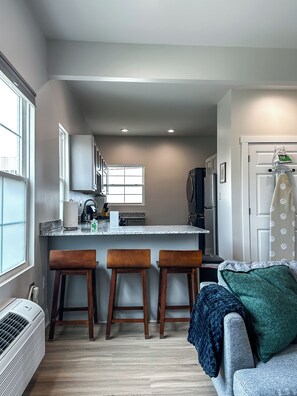 Standard Apartment | Living area | 58-inch Smart TV with digital channels - StayAE - Flamingo House (Baton Rouge)