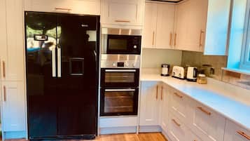 Fridge, microwave, oven, cookware/dishes/utensils