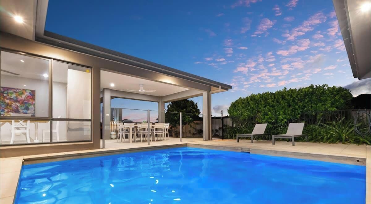 Enjoy a refreshing swim or relax in the private heated pool, nestled among lush greenery.