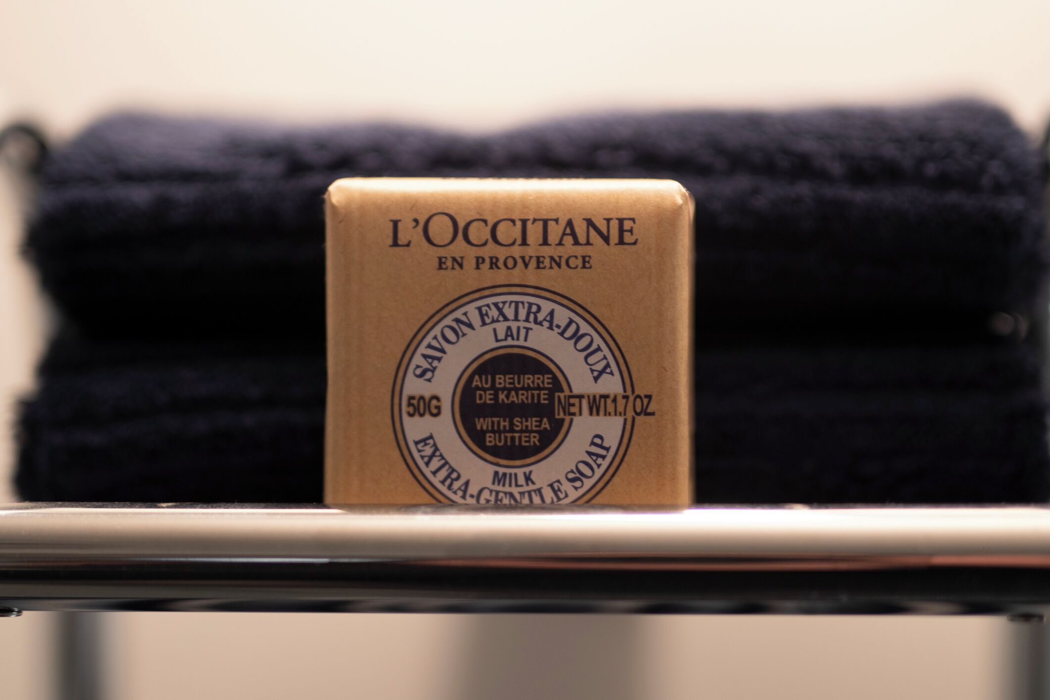 A bar of L'OCCITANE en Provence extra-douce milk soap with a net weight of 1.7 oz (50g).