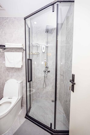 Shower, towels, soap, toilet paper