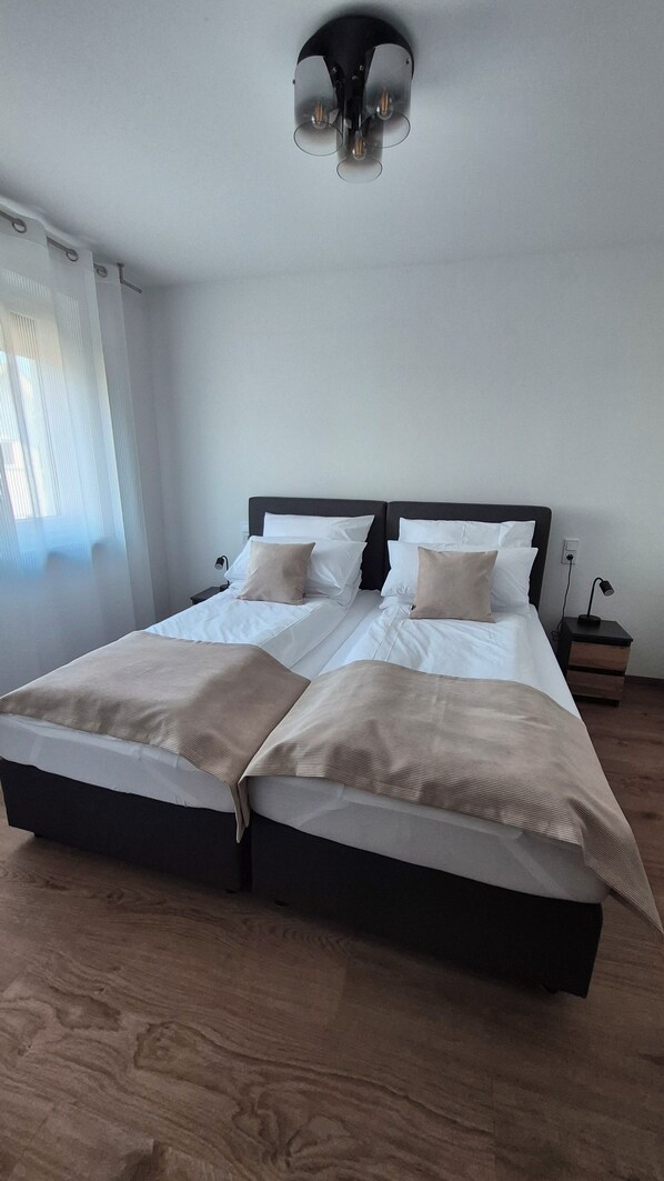 1 bedroom, desk, iron/ironing board, travel crib