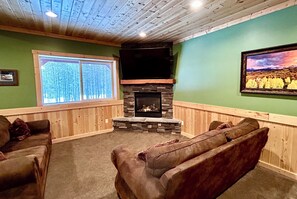 Smart TV, fireplace, table football, books