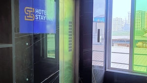 A hotel entrance with a glass door and a sign that reads "HOTEL STAY INN". - Hotel Stay Inn near Bhiwandi Thane Railway Station (Bhiwandi)