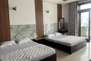 Family Room | Desk, iron/ironing board, free WiFi, bed sheets - Hoa Sen Hotel (Ho Chi Minh City)