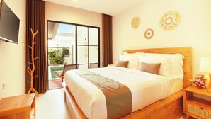 A hotel room with a large bed, a TV, a wooden nightstand, and a view of the outdoors. - The Canggu Dome 2-Roof Top Villa (Canggu)