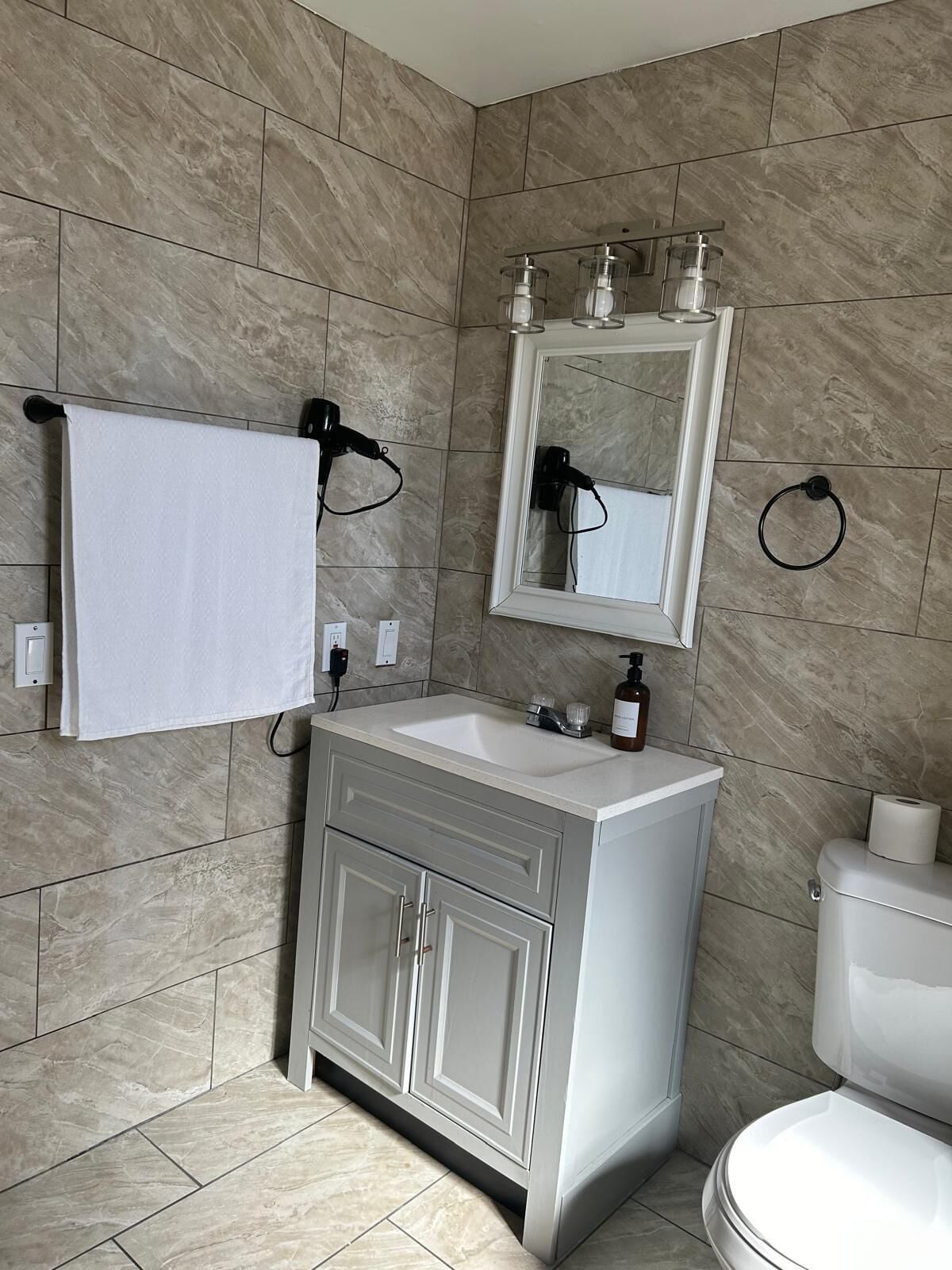 Hair dryer, towels, soap, toilet paper