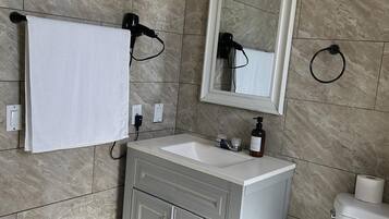 Hair dryer, towels, soap, toilet paper