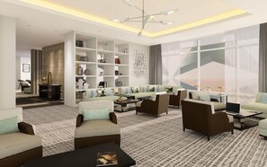 A modern living room with sofas, a coffee table, and a bookshelf. - Sofitel Riyadh Hotel & Convention Centre (Riyadh)