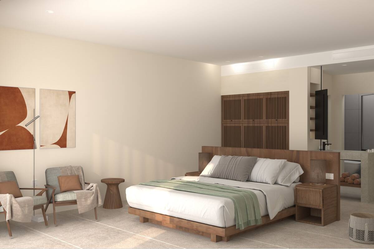 A modern bedroom with a large bed, wooden headboard, two nightstands, a side table, and a chair.