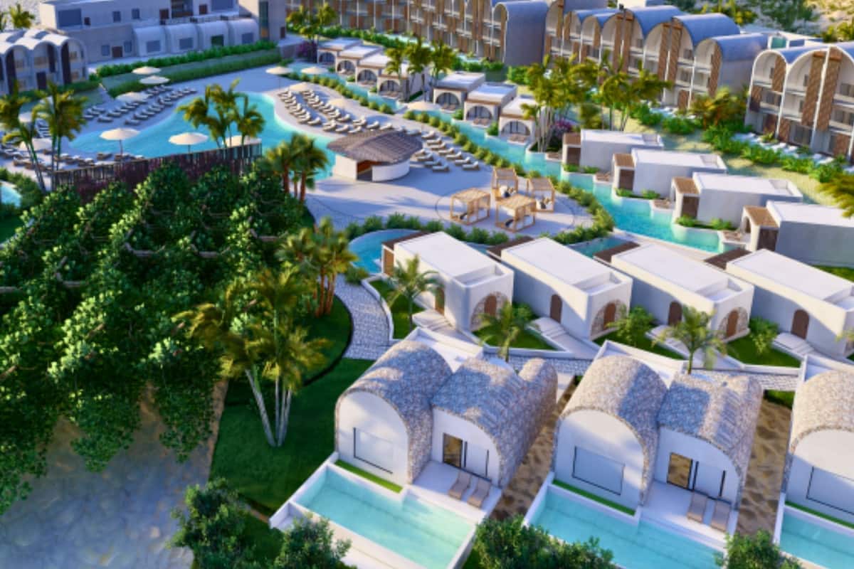 A resort with multiple villas, a central pool, and palm trees.