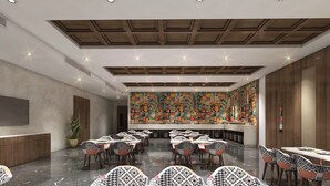 A spacious conference room with a high ceiling, wooden paneling, and a large mural on the back wall. Tables and chairs are arranged for meetings. - Zone Connect by The Park Prayagraj (Prayagraj)