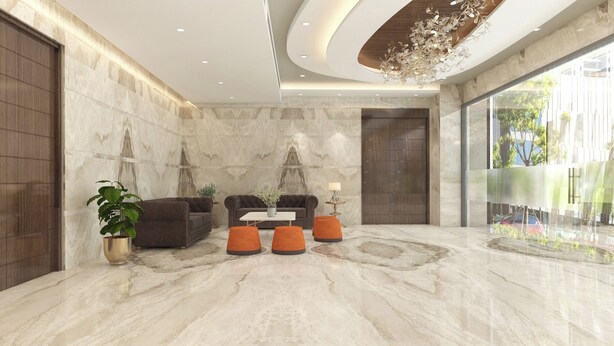 A modern lobby with a marble floor, leather sofas, and orange ottomans. - Zone Connect by The Park Prayagraj (Prayagraj)