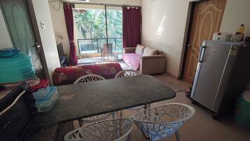 Appartement Confort, vue piscine | Coin séjour