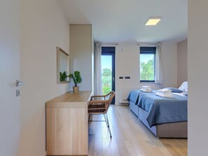 A bedroom with a bed, bedside table, chair, and a window. - Stunning private villa for 8 people with A/C, private pool, WIFI, TV and terrace (Pazin)